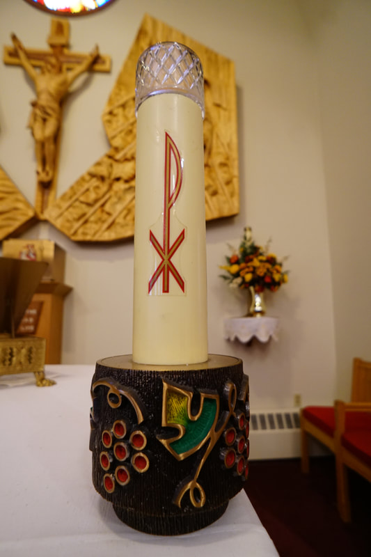 Candle on front altar